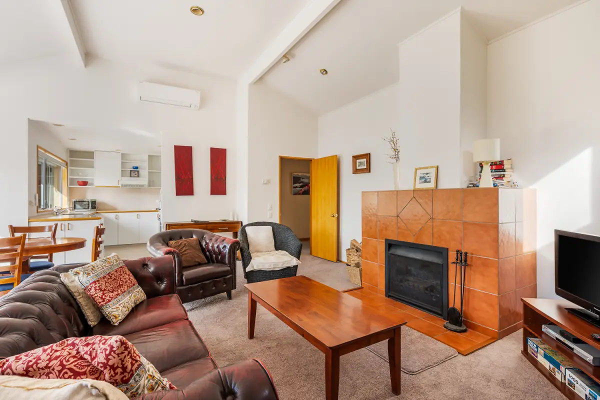 Open living with fireplace and heat pump