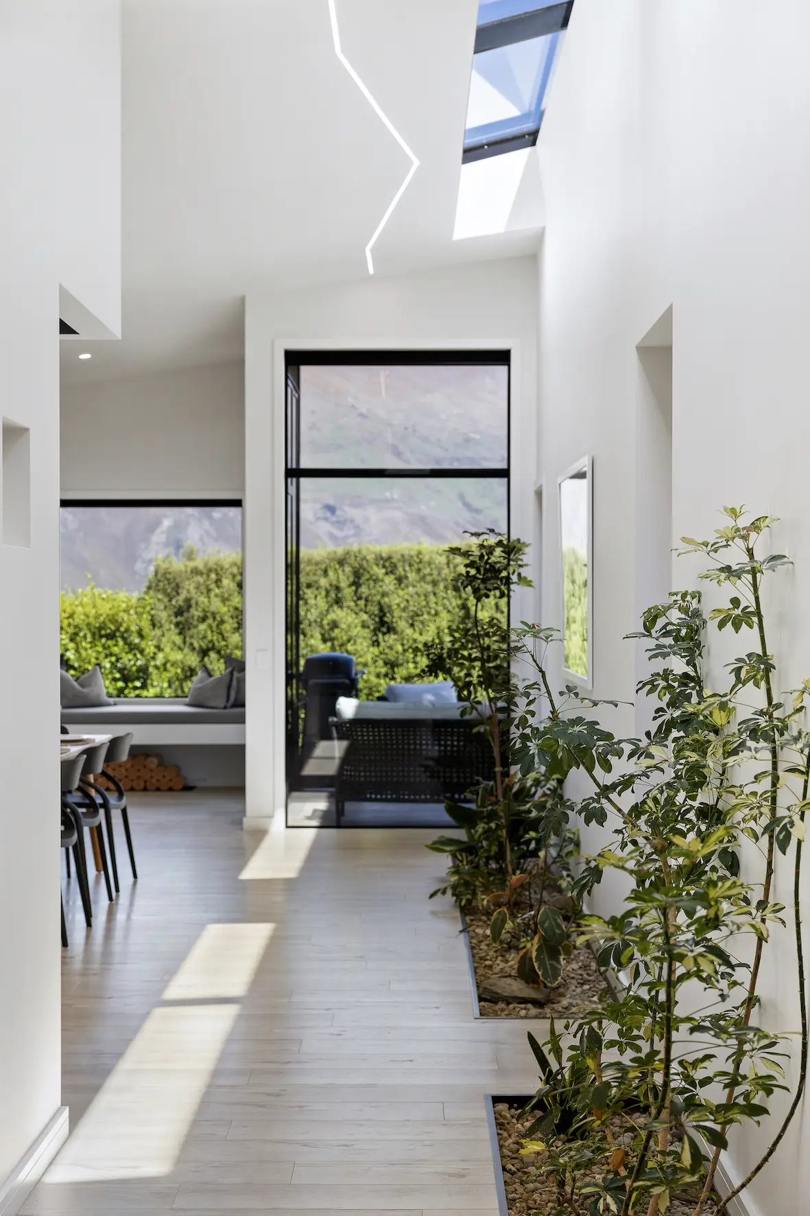 Light-filled Hallway with Indoor Greenery 