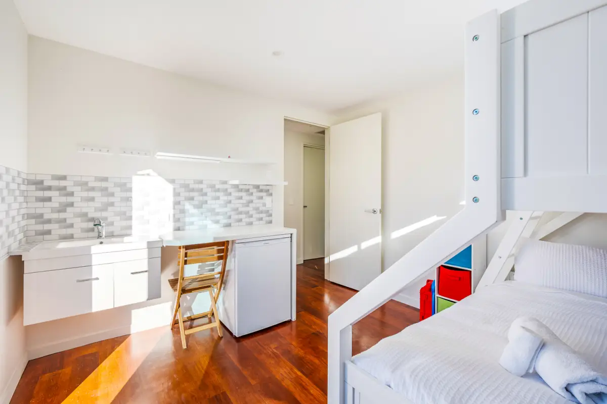 Bunk Room with Sink and Desk Area 
