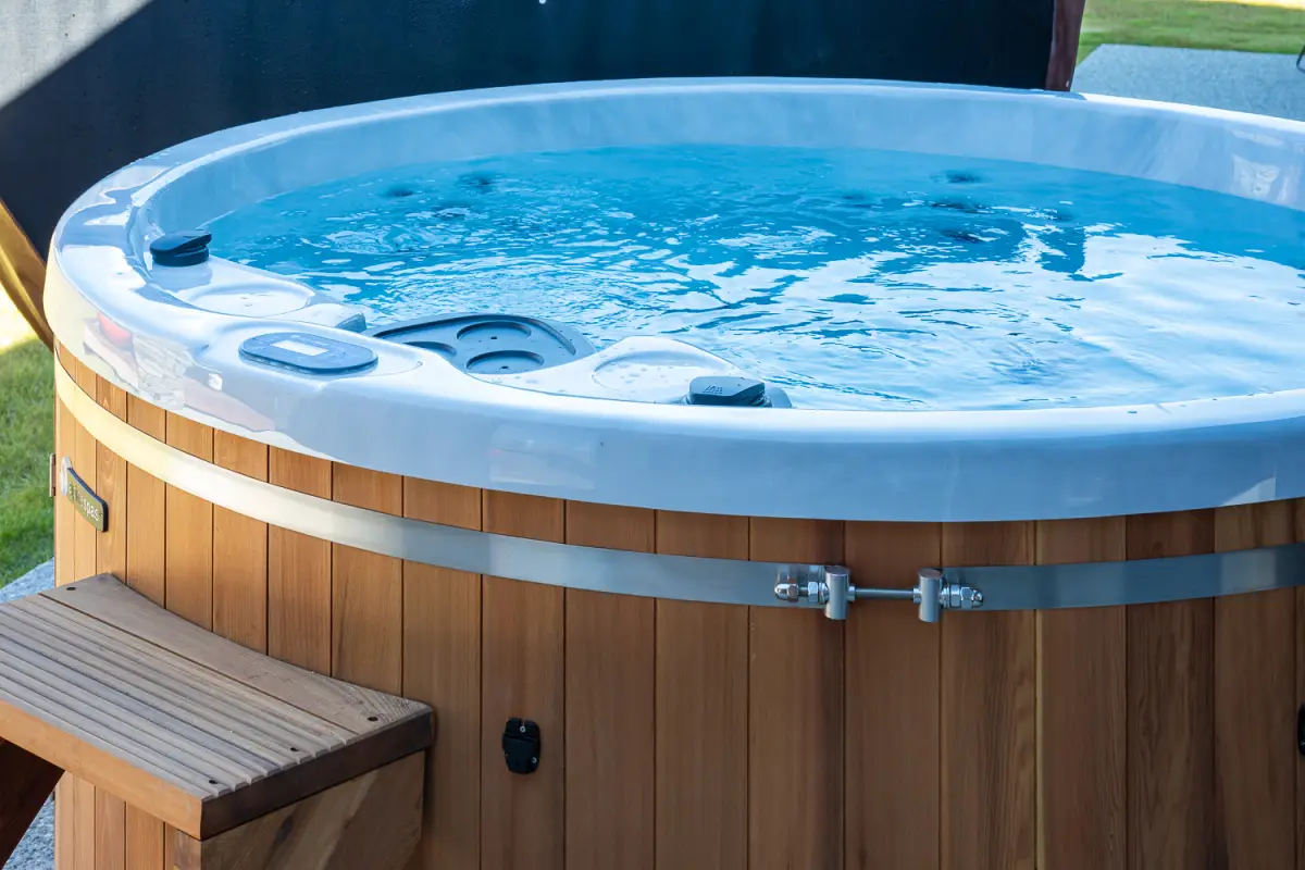 Luxurious wooden hot tub, perfect for relaxing after a busy day exploring Wanaka
